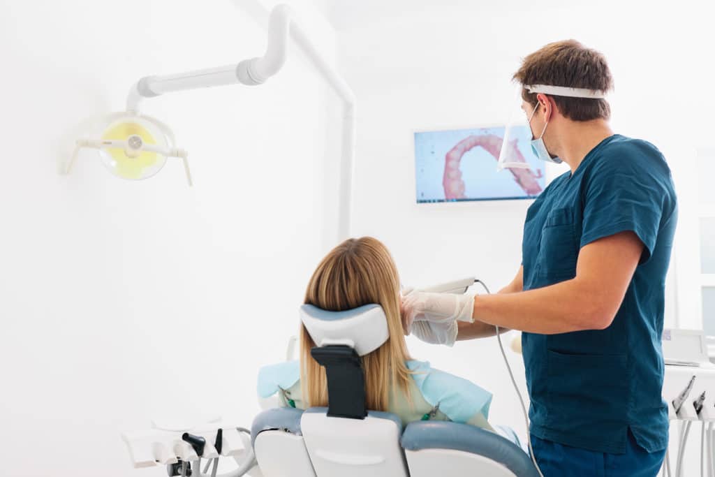 The,Dentist,Scans,The,Patient’s,Teeth,With,A,3d,Scanner.